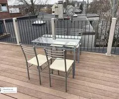 Glass and metal table with 4 chairs - dining set